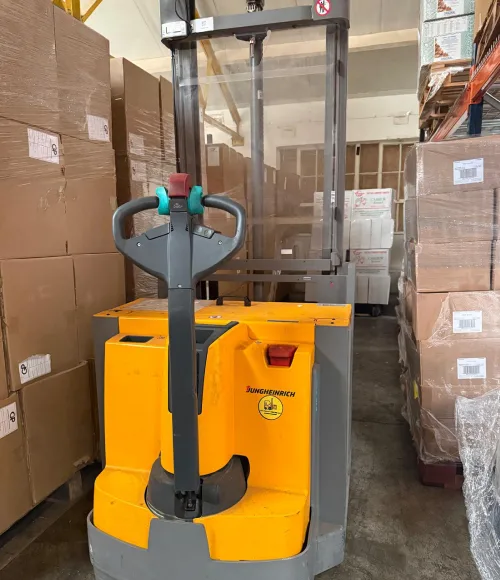 Warehouse pallet stacker operator training covering equipment checks and handling basics